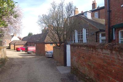 the Tavern used to stand where the one storey structure nearest the camera is and te Plough in the similar structure just past the silver car Mar 2007